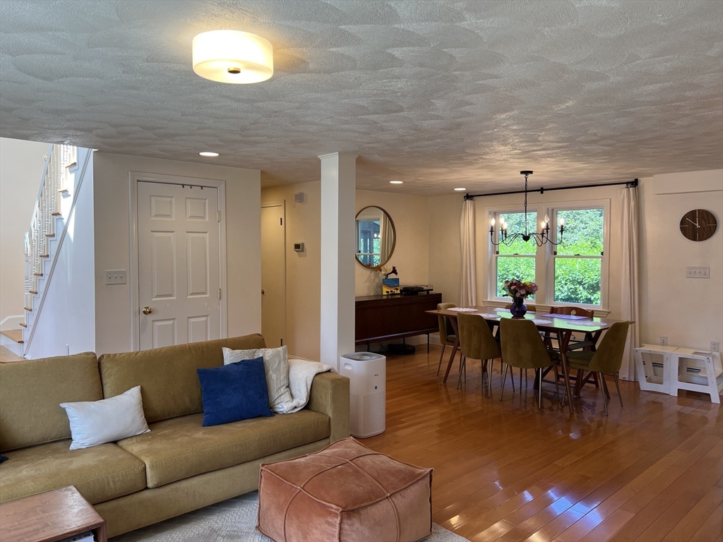 11 Garrison Road, Unit 1 Arlington, MA 02474 - Photo 13 of 42 a living room with furniture and a large window