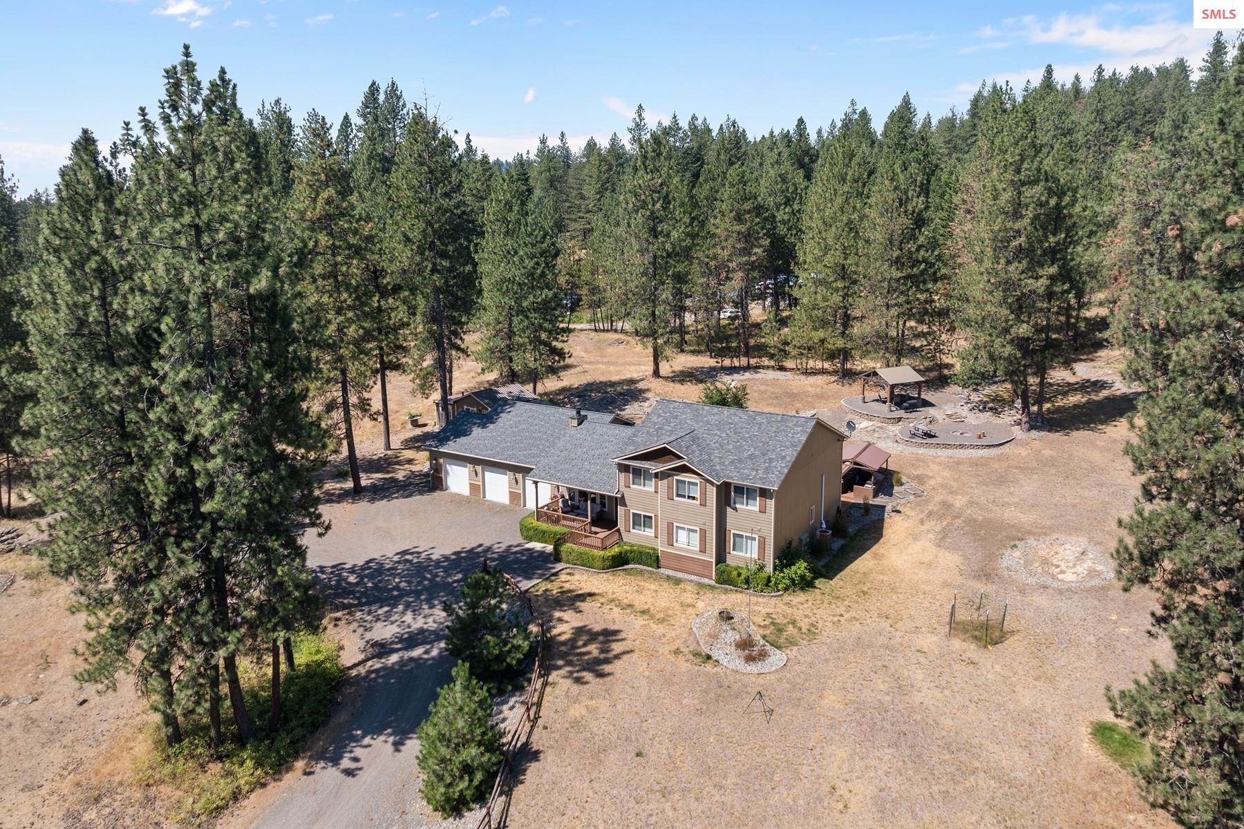 18341 West Highway 53 Rathdrum, ID 83858 - Photo 35 of 41 Large home with 2 finished out buildings, great outdoor living space close to amenities.