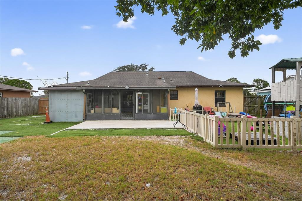 1644 Ruth Street Cocoa, FL 32926 - Photo 25 of 38 a front view of a house with a garden and porch