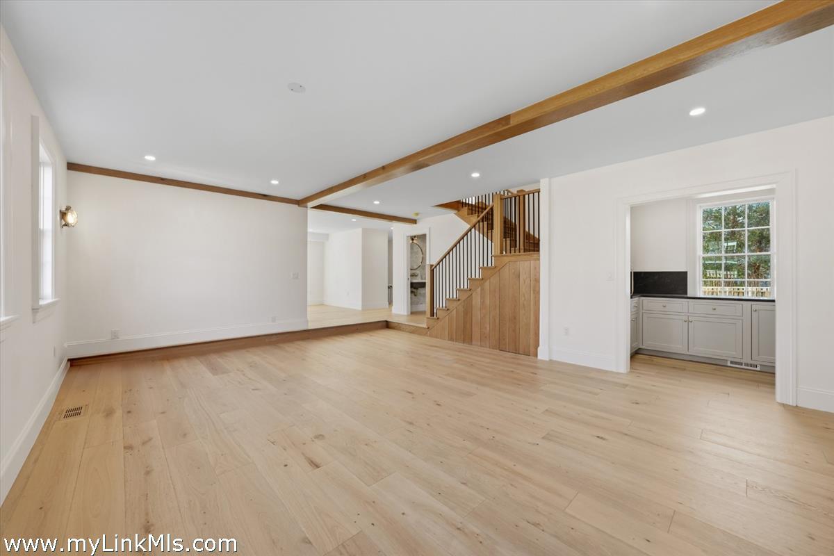 85 Orange Street Nantucket, MA 02554 - Photo 27 of 89 a view of empty room with wooden floor and windows