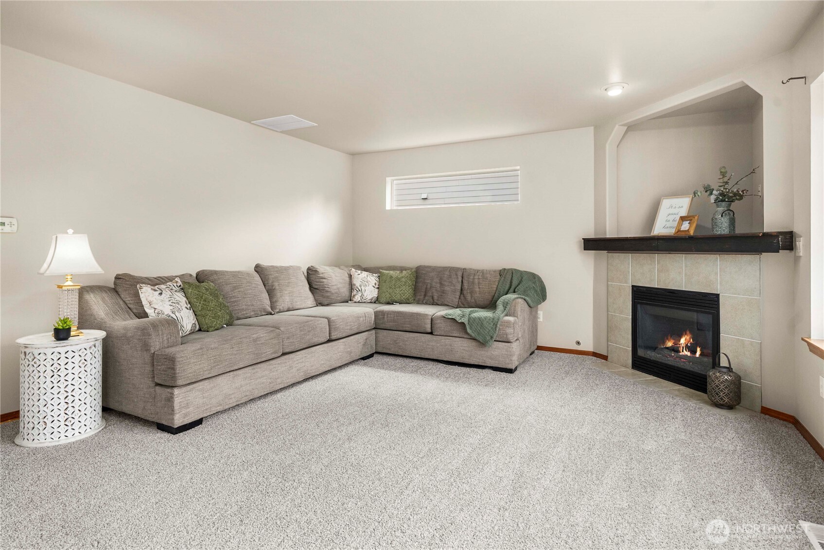 1503 Riddell Avenue Northeast Orting, WA 98360 - Photo 16 of 40 a living room with furniture and a fireplace