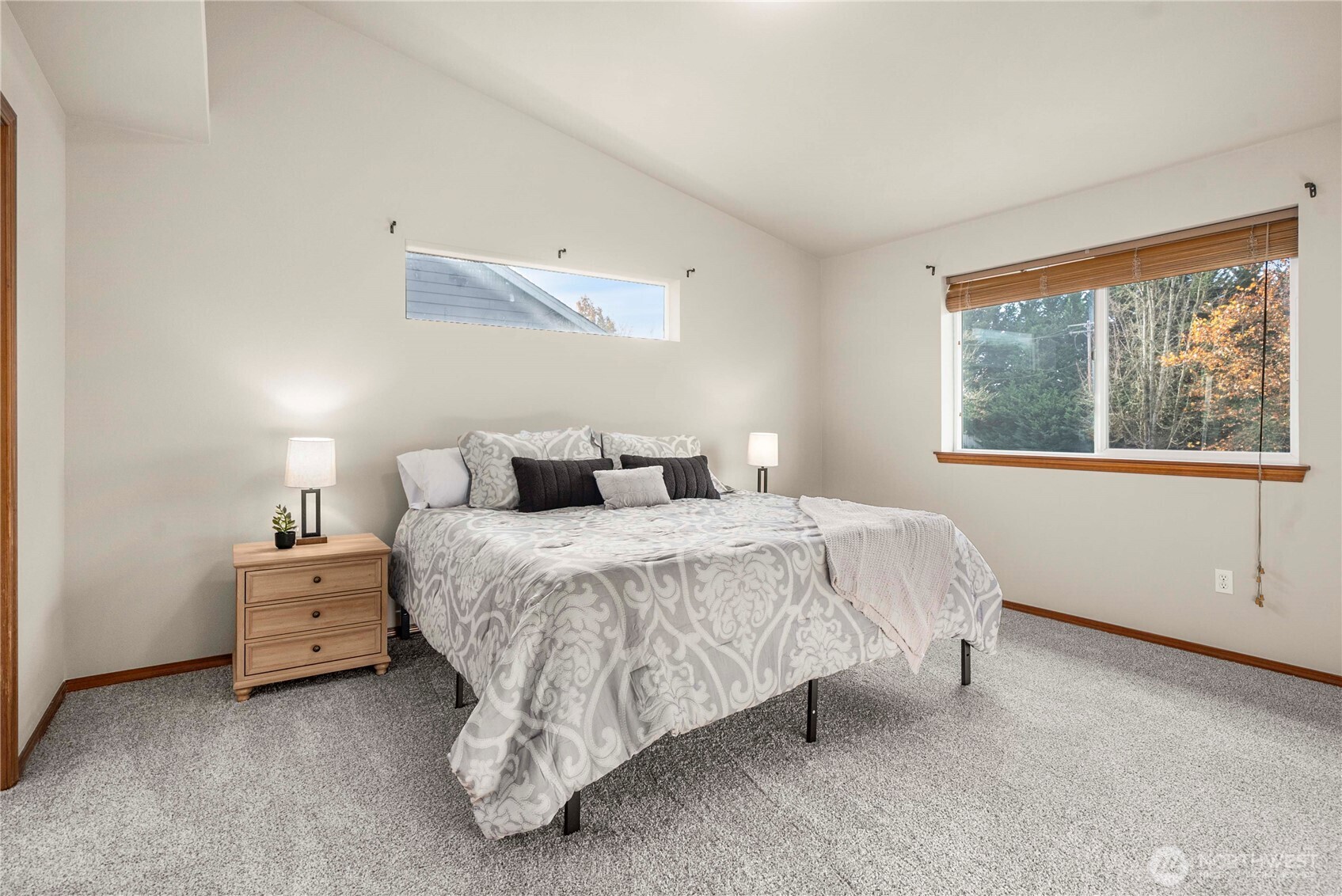 1503 Riddell Avenue Northeast Orting, WA 98360 - Photo 18 of 40 a bedroom with a bed and a large window