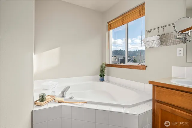 a bathroom with a sink and a window