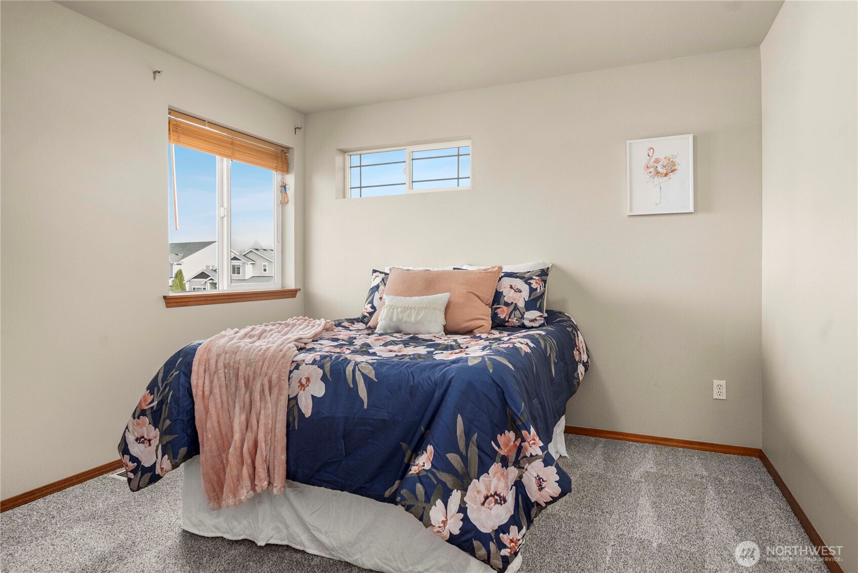 1503 Riddell Avenue Northeast Orting, WA 98360 - Photo 24 of 40 a bed sitting in a bedroom next to a window