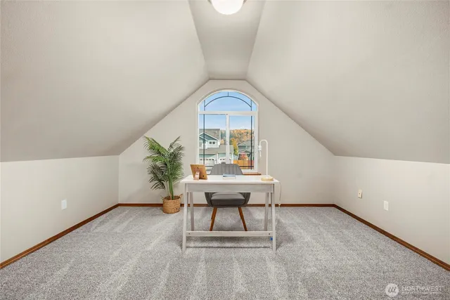 a workspace with furniture and window