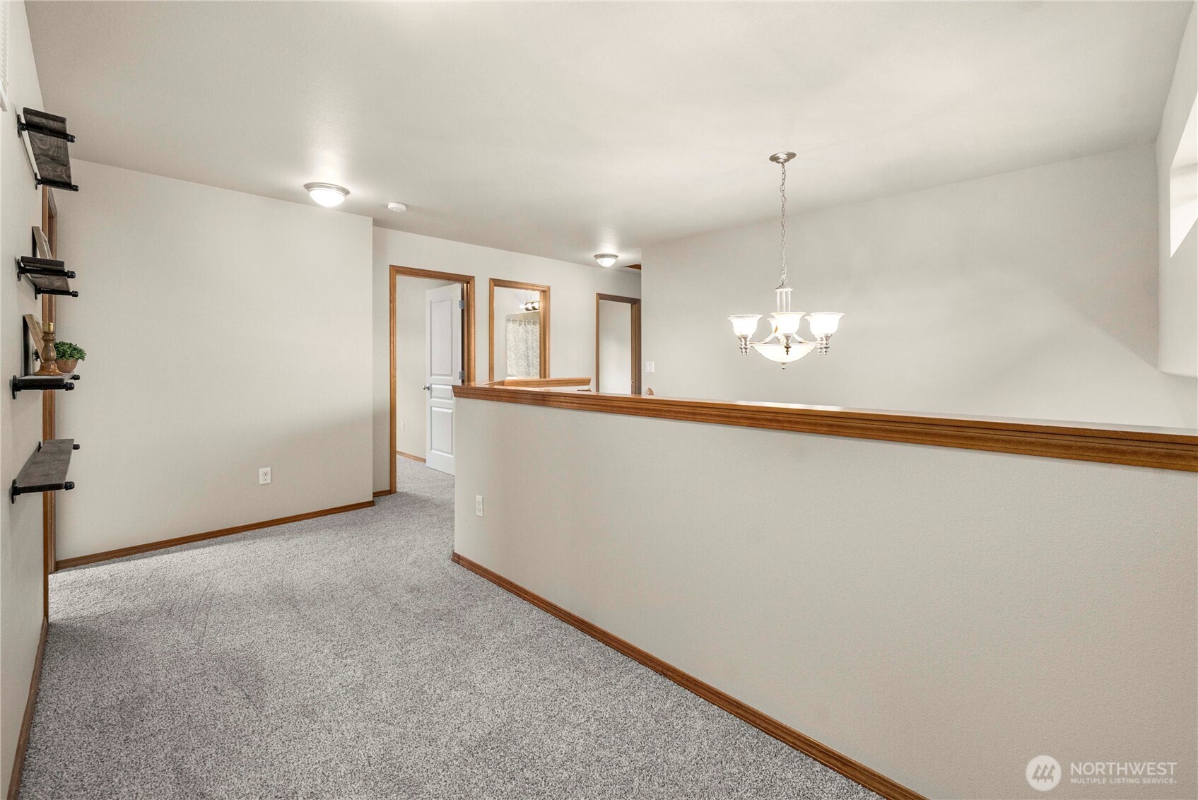 1503 Riddell Avenue Northeast Orting, WA 98360 - Photo 31 of 40 wooden floor in an empty room with a window
