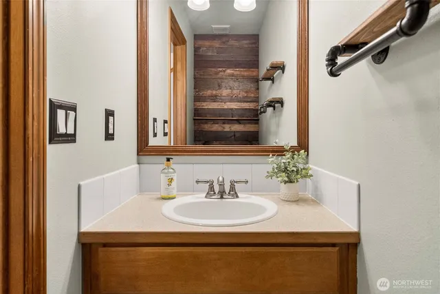 a bathroom with a sink and a mirror