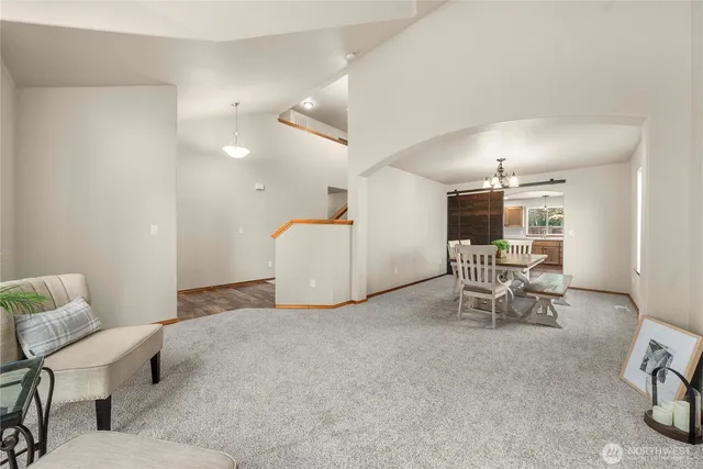 a living room with furniture and a table