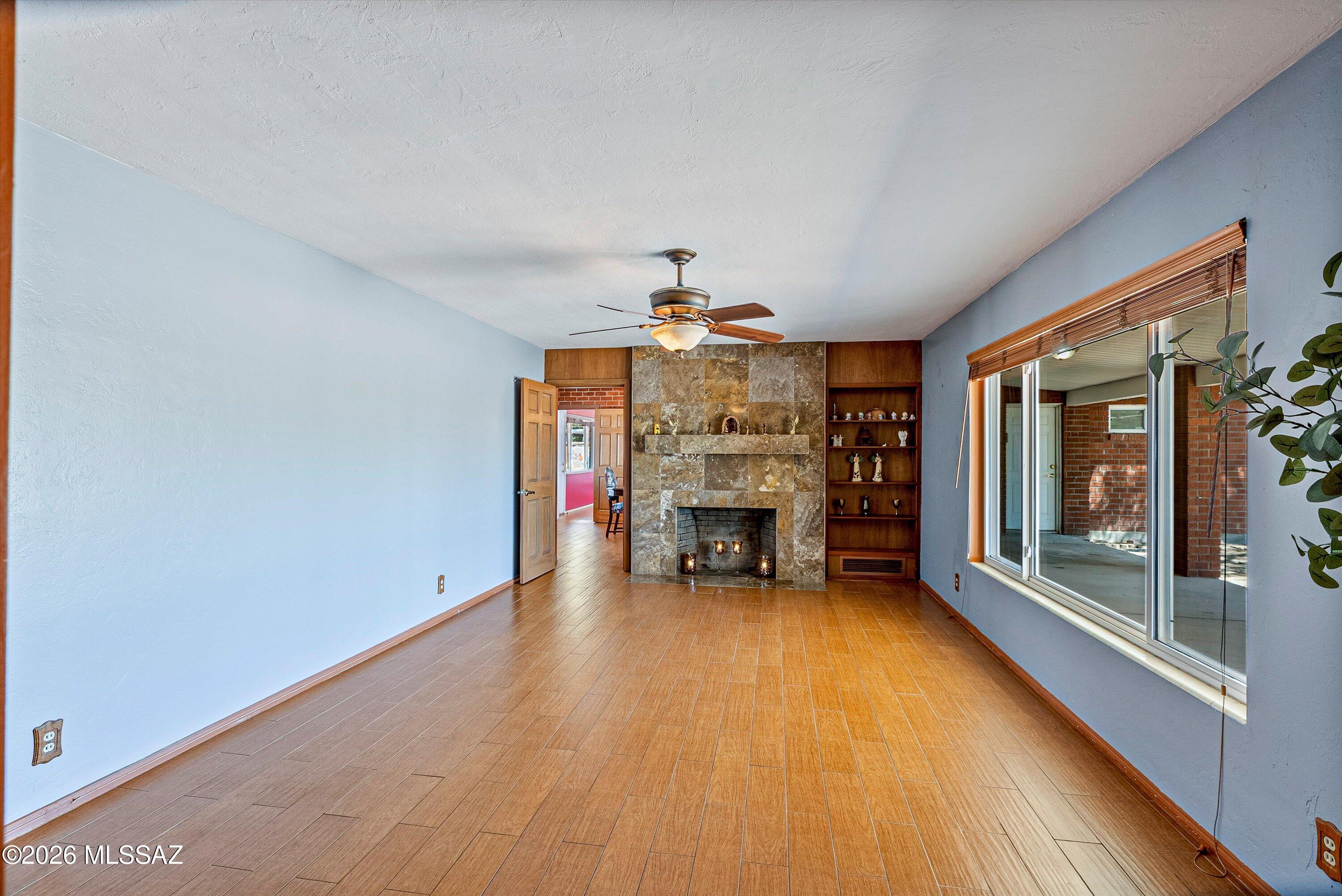 2107 East Lind Road Tucson, AZ 85719 - Photo 7 of 43 a view of an empty room with fire place and a fireplace