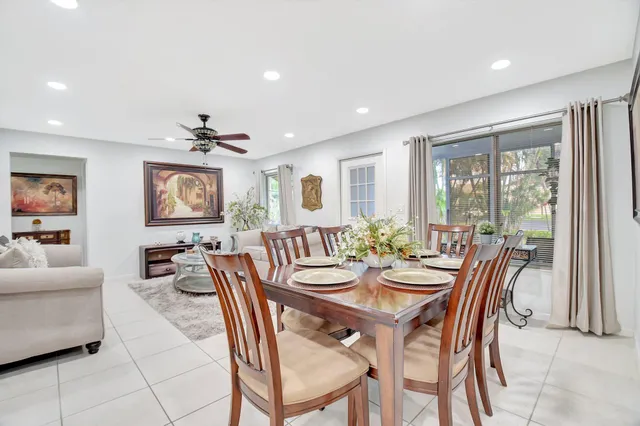 a view of a dining room with furniture and a livingroom