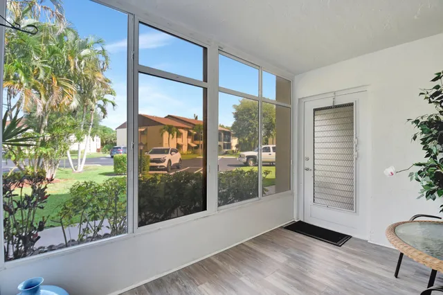 a view of a glass door with a balcony
