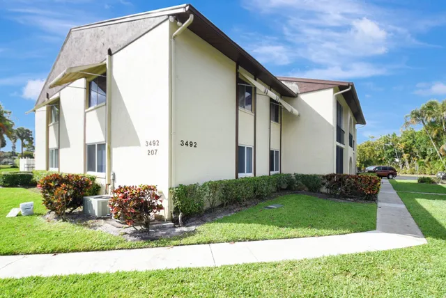 a backyard of a house with seating space