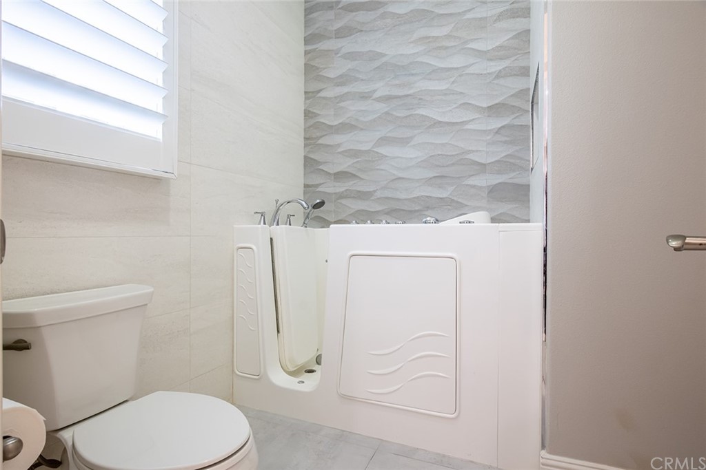 124 Panorama Irvine, CA 92618 - Photo 16 of 61 a white toilet sitting next to a shower curtain