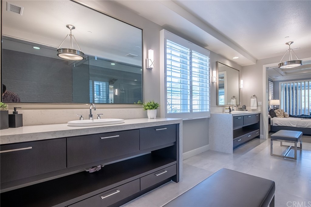 124 Panorama Irvine, CA 92618 - Photo 32 of 61 a spacious bathroom with a double vanity sink a mirror and a bathtub