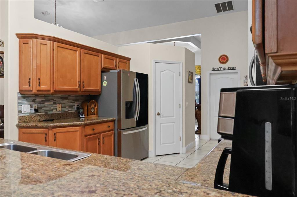 1 Elder Place Palm Coast, FL 32164 - Photo 11 of 34 a kitchen with stainless steel appliances granite countertop a refrigerator and a sink