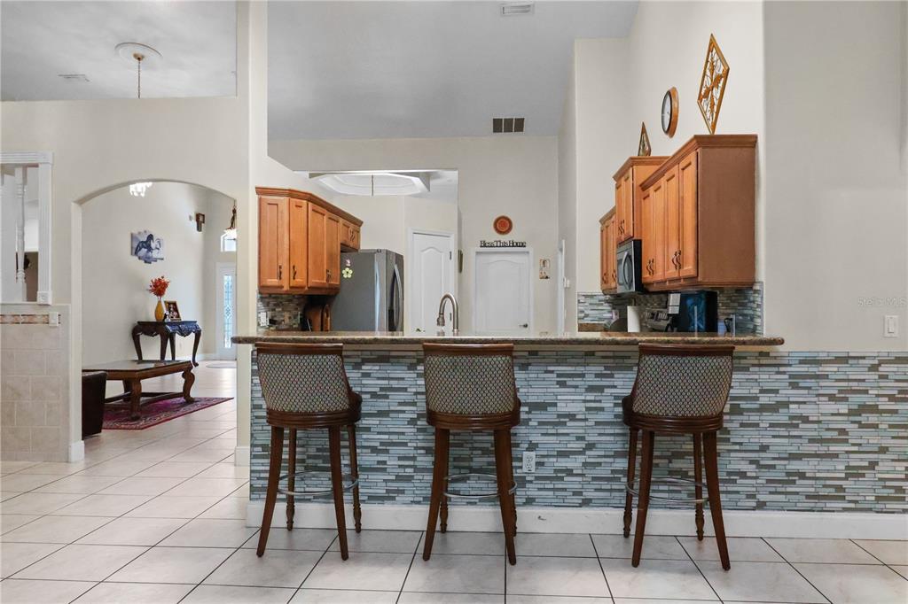 1 Elder Place Palm Coast, FL 32164 - Photo 12 of 34 a bathroom with a sink and a mirror