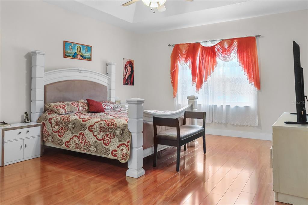 1 Elder Place Palm Coast, FL 32164 - Photo 15 of 34 a bedroom with a bed and a flat screen tv