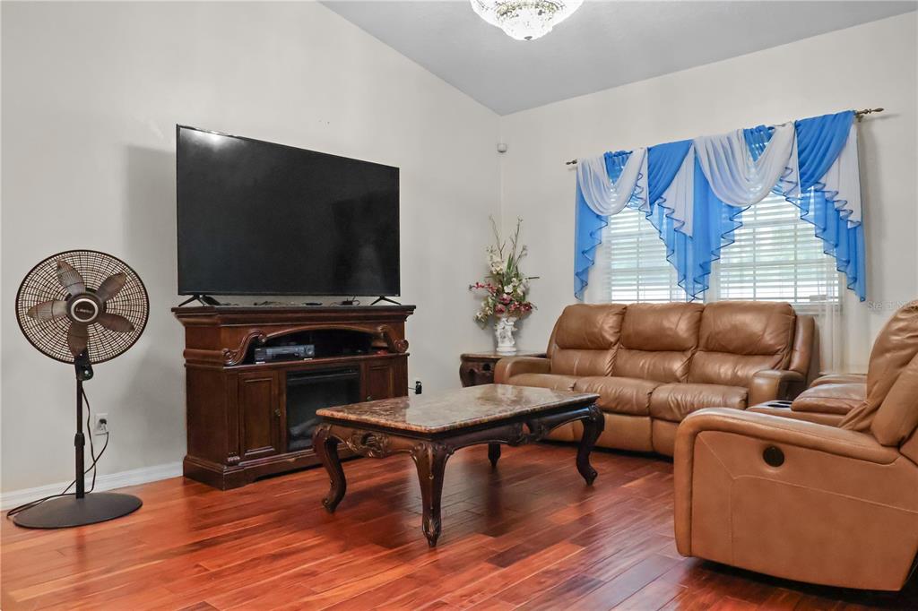 1 Elder Place Palm Coast, FL 32164 - Photo 8 of 34 a living room with furniture and a flat screen tv