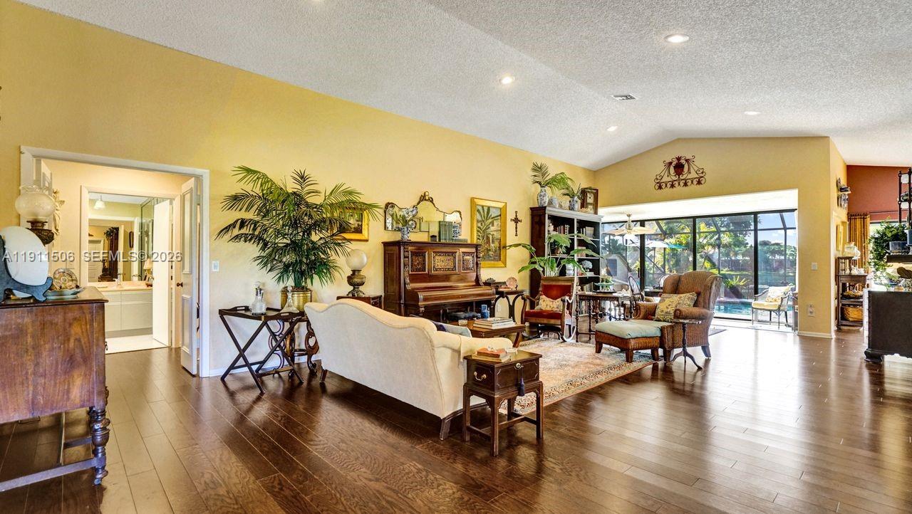 10858 White Aspen Lane Boca Raton, FL 33428 - Photo 3 of 72 a living room with furniture and a large window