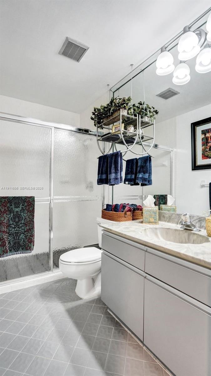 10858 White Aspen Lane Boca Raton, FL 33428 - Photo 33 of 72 a bathroom with a toilet sink and shower