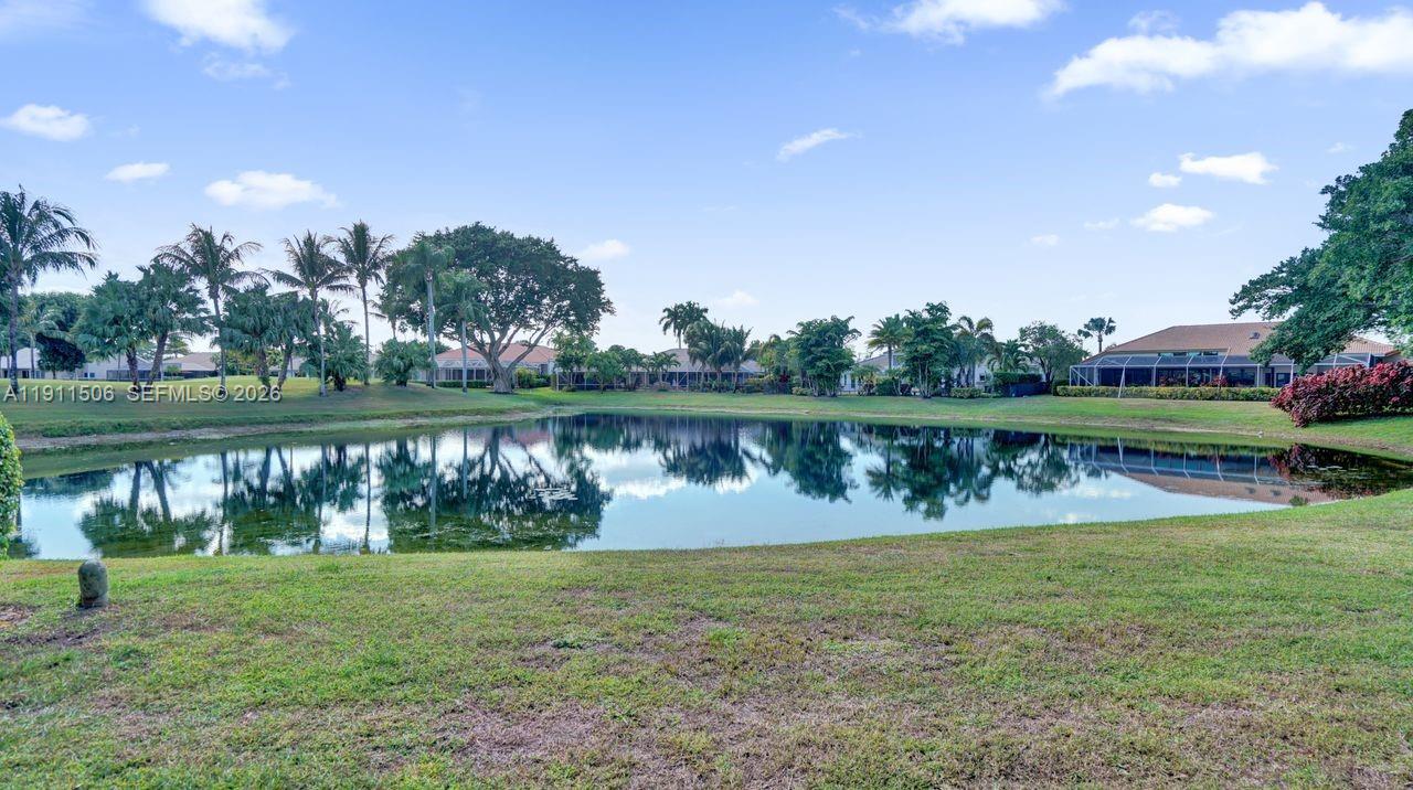 10858 White Aspen Lane Boca Raton, FL 33428 - Photo 45 of 72 a view of a lake with a big yard