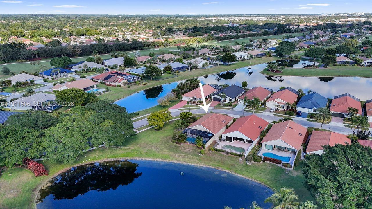 10858 White Aspen Lane Boca Raton, FL 33428 - Photo 47 of 72 an aerial view of a house with a garden