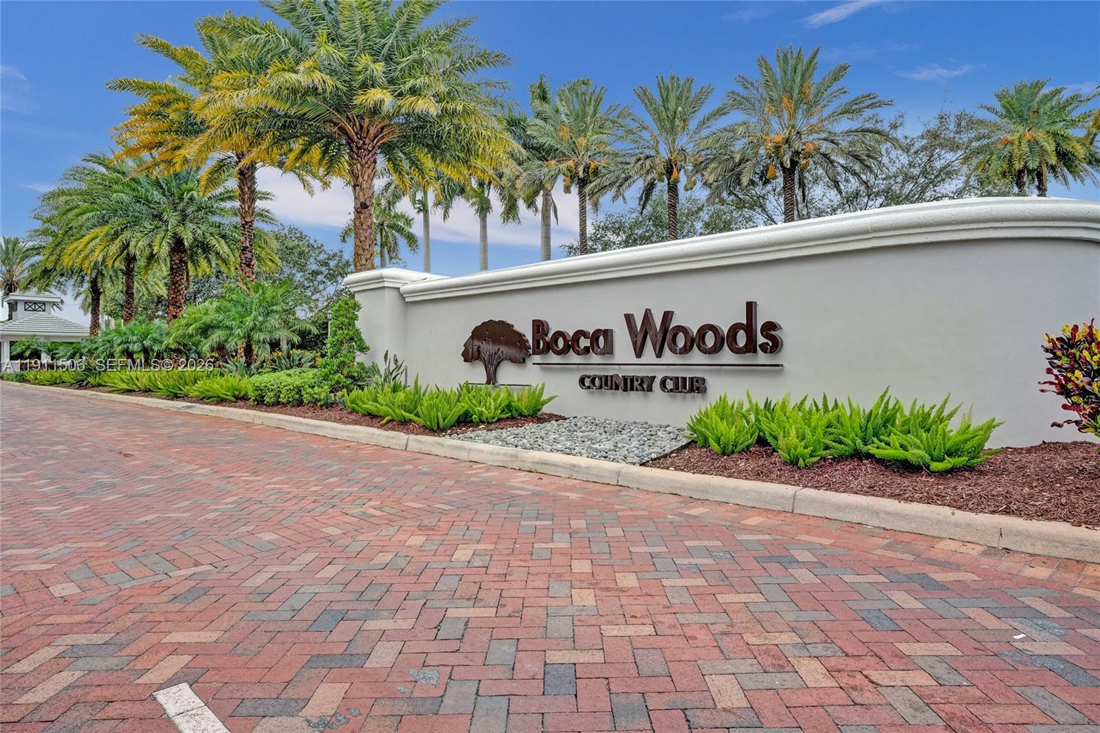 10858 White Aspen Lane Boca Raton, FL 33428 - Photo 49 of 72 a sign that is on the side of a building