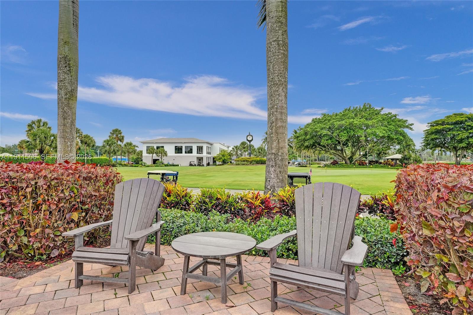 10858 White Aspen Lane Boca Raton, FL 33428 - Photo 59 of 72 a view of a chairs and table in patio next to a yard
