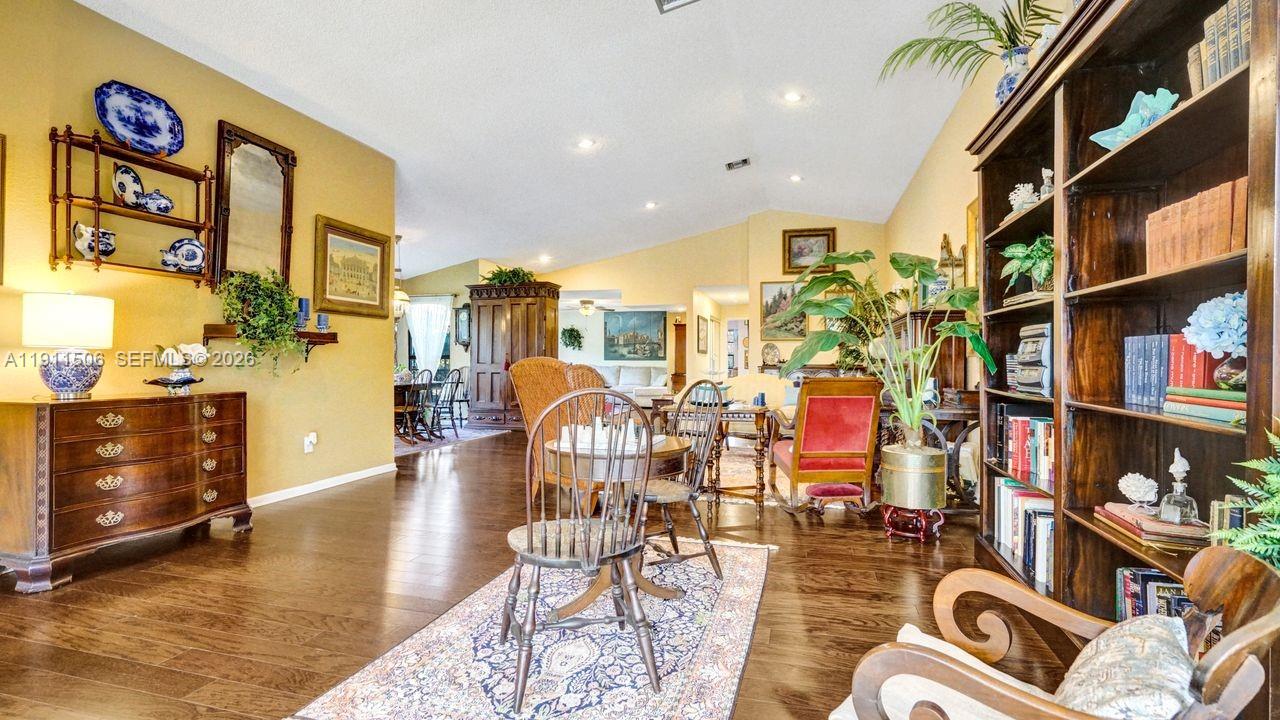 10858 White Aspen Lane Boca Raton, FL 33428 - Photo 10 of 72 a room with lots of white furniture and a rug