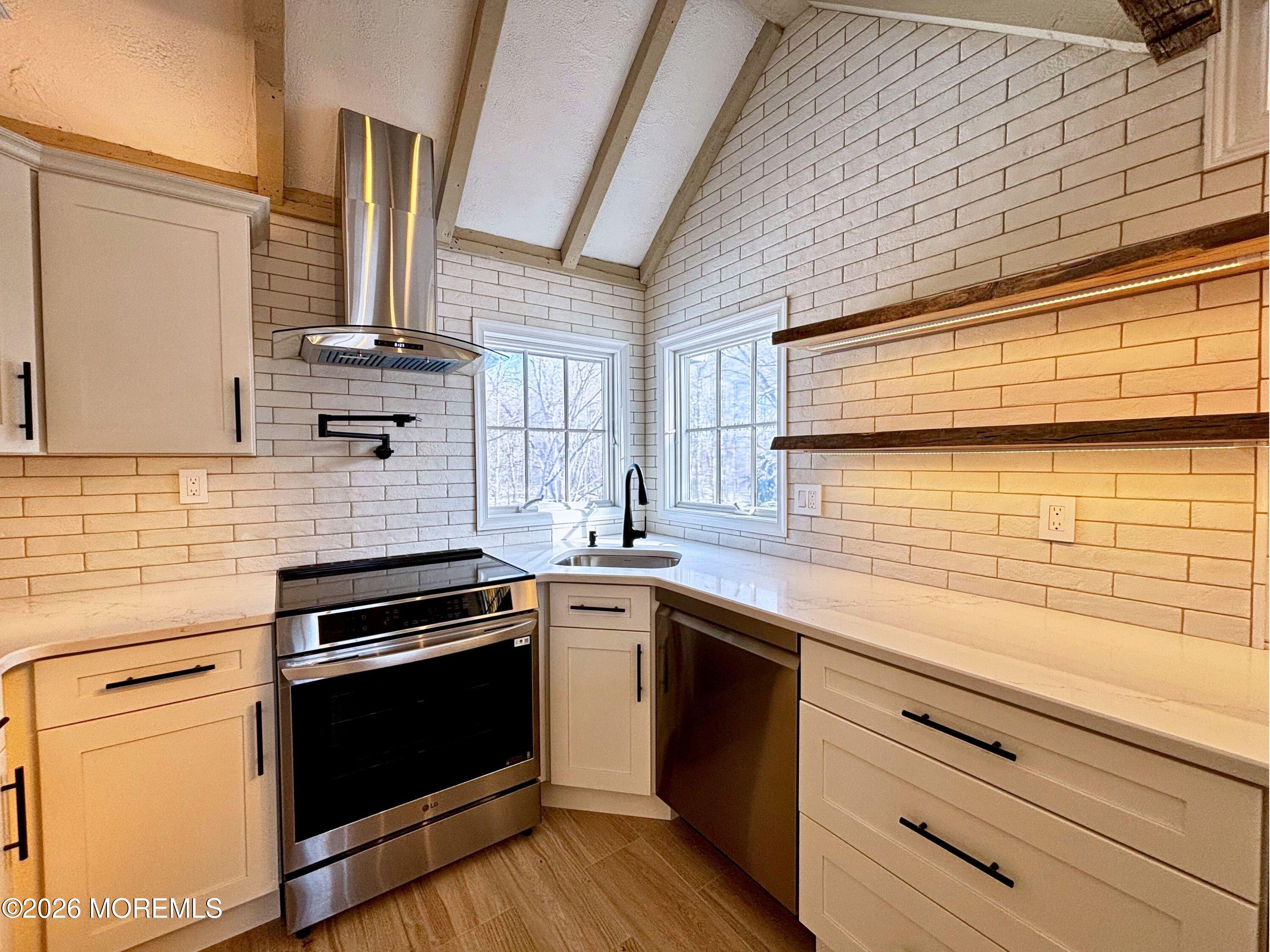 2364 Hurley Pond Road, Unit BACK TOP Wall, NJ 07719 - Photo 2 of 11 a kitchen with a sink and cabinets