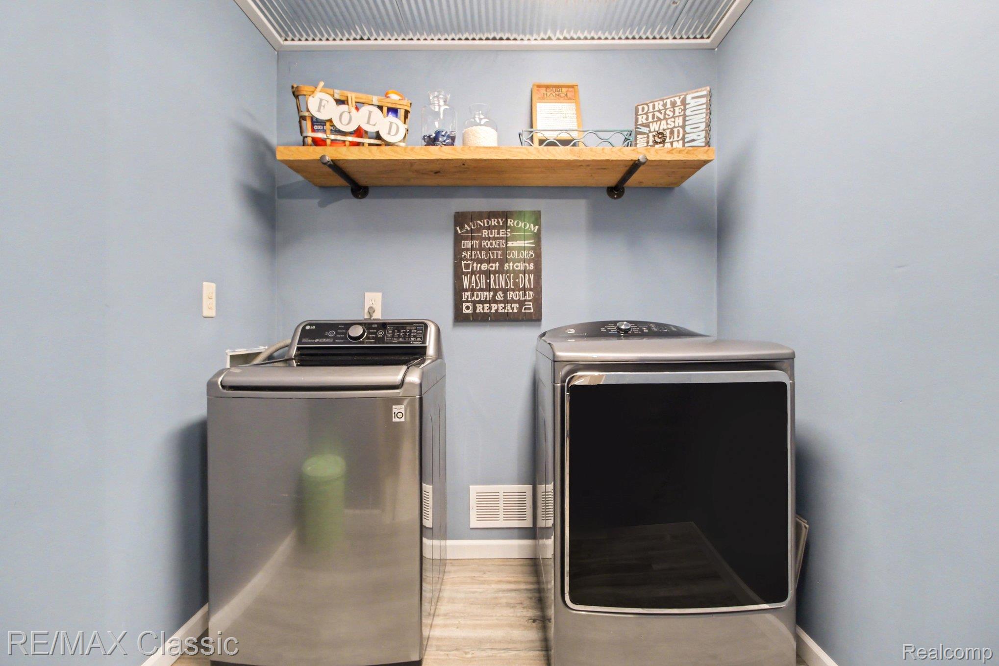 9800 Moon Road Saline, MI 48176 - Photo 12 of 38 Laundry area with independent washer and dryer and light wood-type flooring