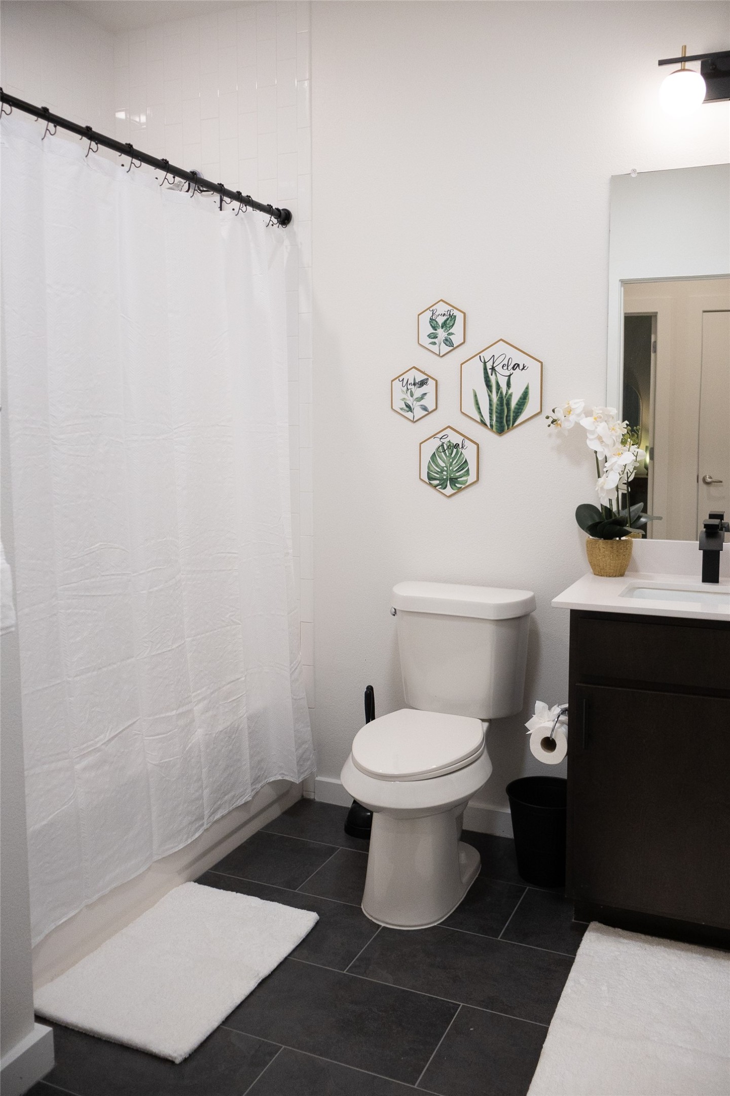 2505 Thornton Road, Unit 3108 Austin, TX 78704 - Photo 20 of 32 a white toilet sitting next to a bathroom sink