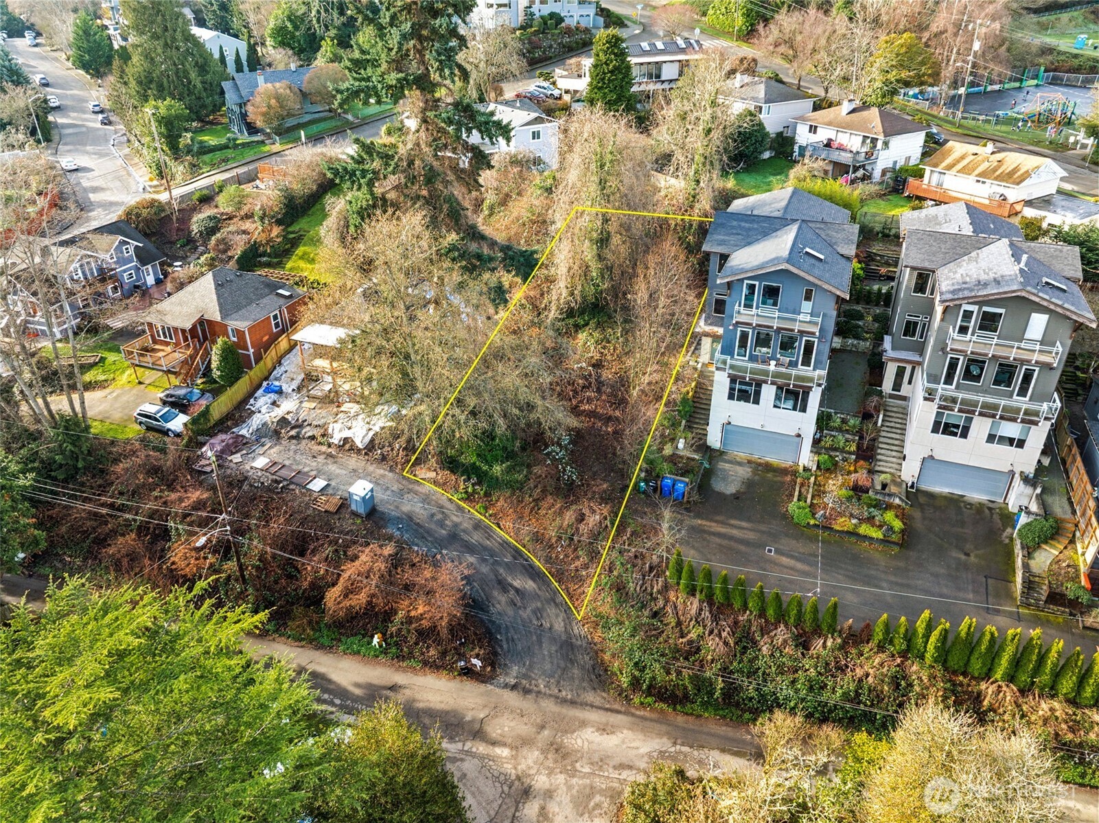 4019 Burton Place West Seattle, WA 98199 - Photo 13 of 18 an aerial view of residential houses with yard
