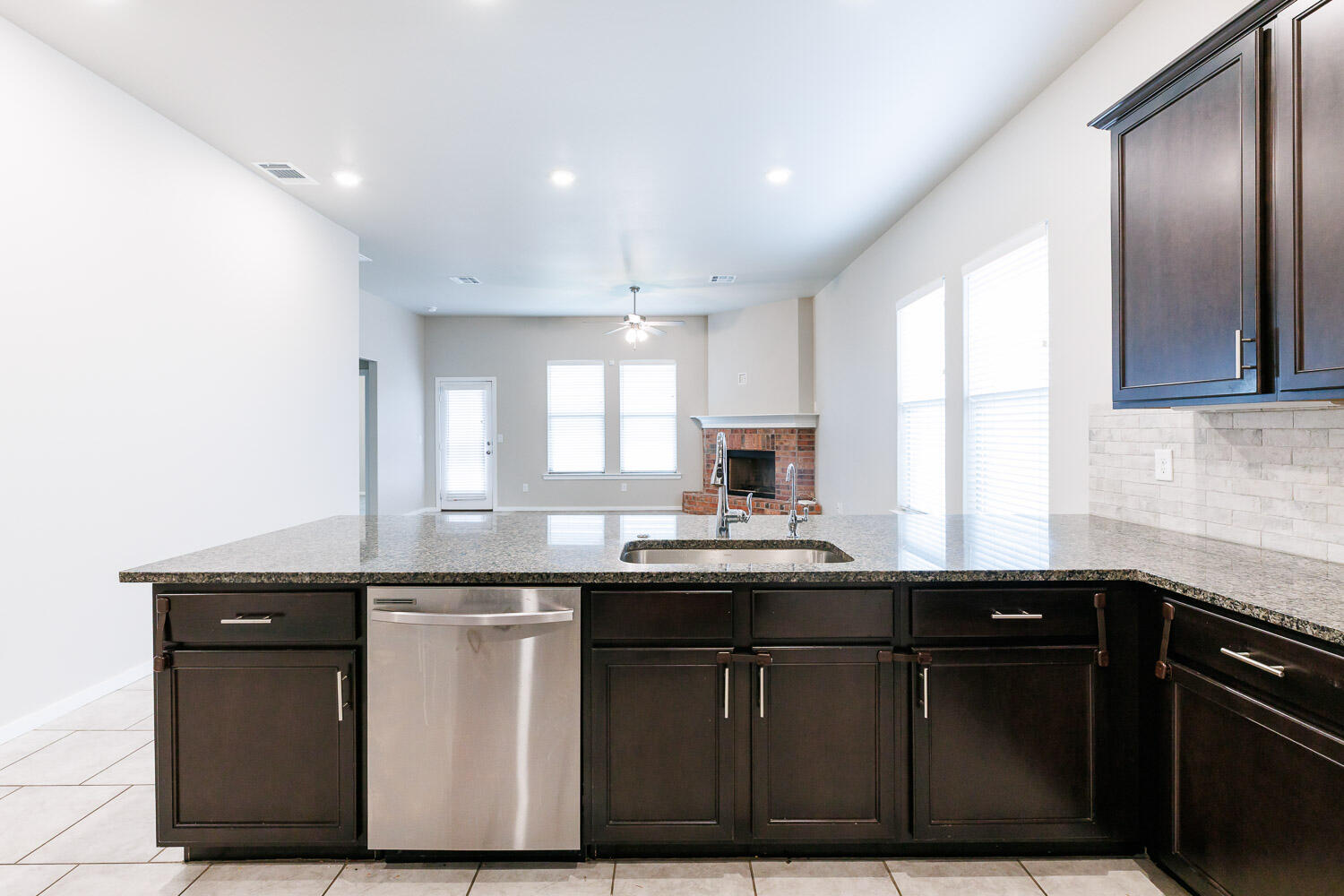 7509 26th Street Lubbock, TX 79407 - Photo 15 of 48 a kitchen with a sink and cabinets