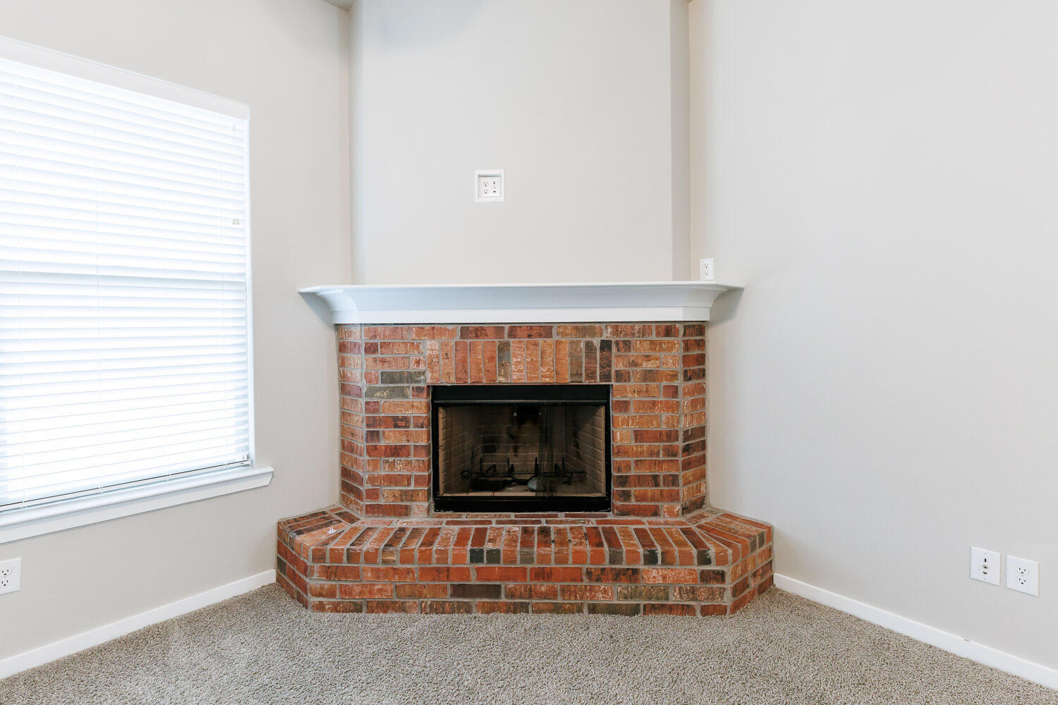 7509 26th Street Lubbock, TX 79407 - Photo 22 of 48 a living room with furniture and a fireplace