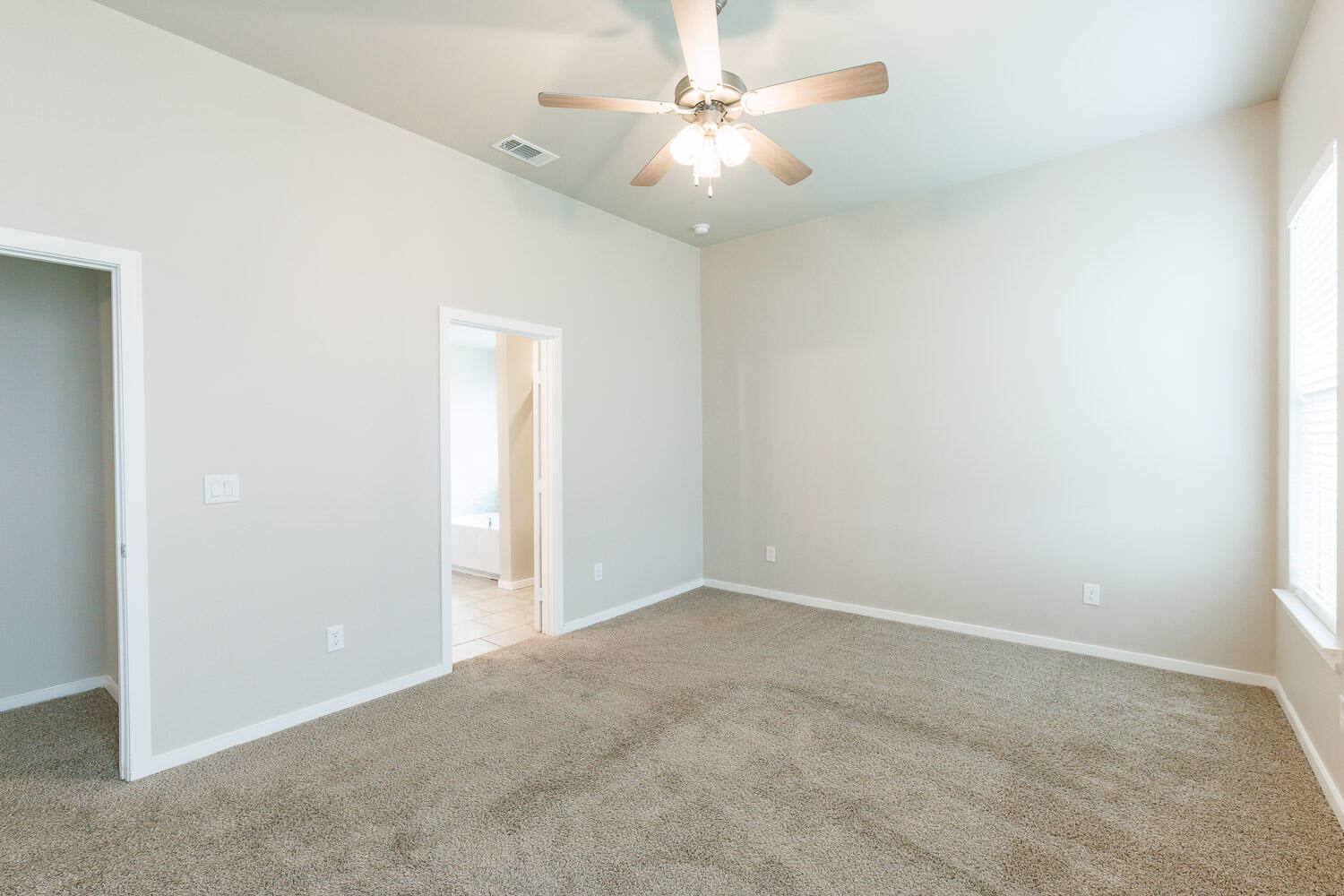 7509 26th Street Lubbock, TX 79407 - Photo 28 of 48 an empty room with windows and fan