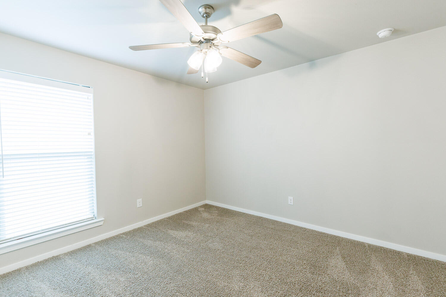 7509 26th Street Lubbock, TX 79407 - Photo 40 of 48 an empty room with a window and a fan