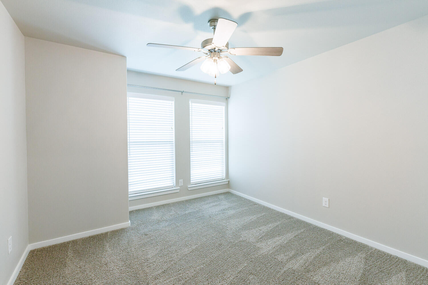 7509 26th Street Lubbock, TX 79407 - Photo 43 of 48 an empty room with a window and a fan
