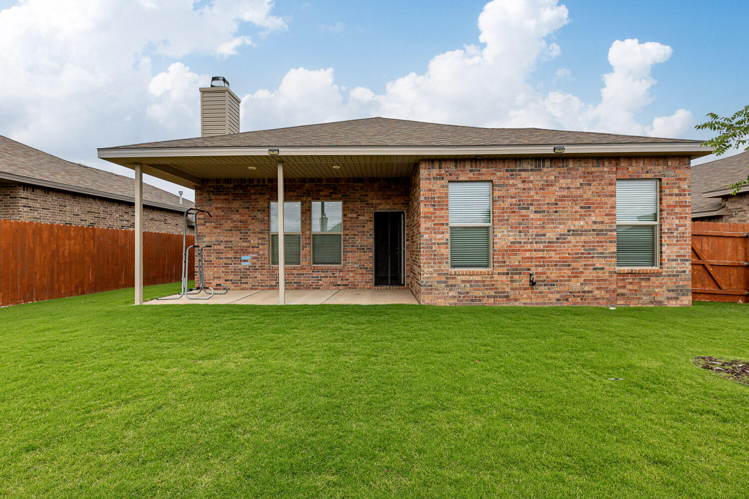 7509 26th Street Lubbock, TX 79407 - Photo 48 of 48 a front view of a house with garden