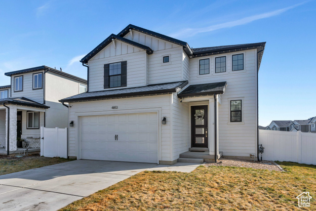 4853 Breezy Patch Road Eagle Mountain, UT 84005 - Photo 1 of 1 View of front of home with a front yard and a garage