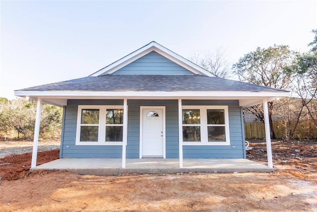 a house with trees in the background