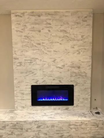 a view of empty room with a fireplace