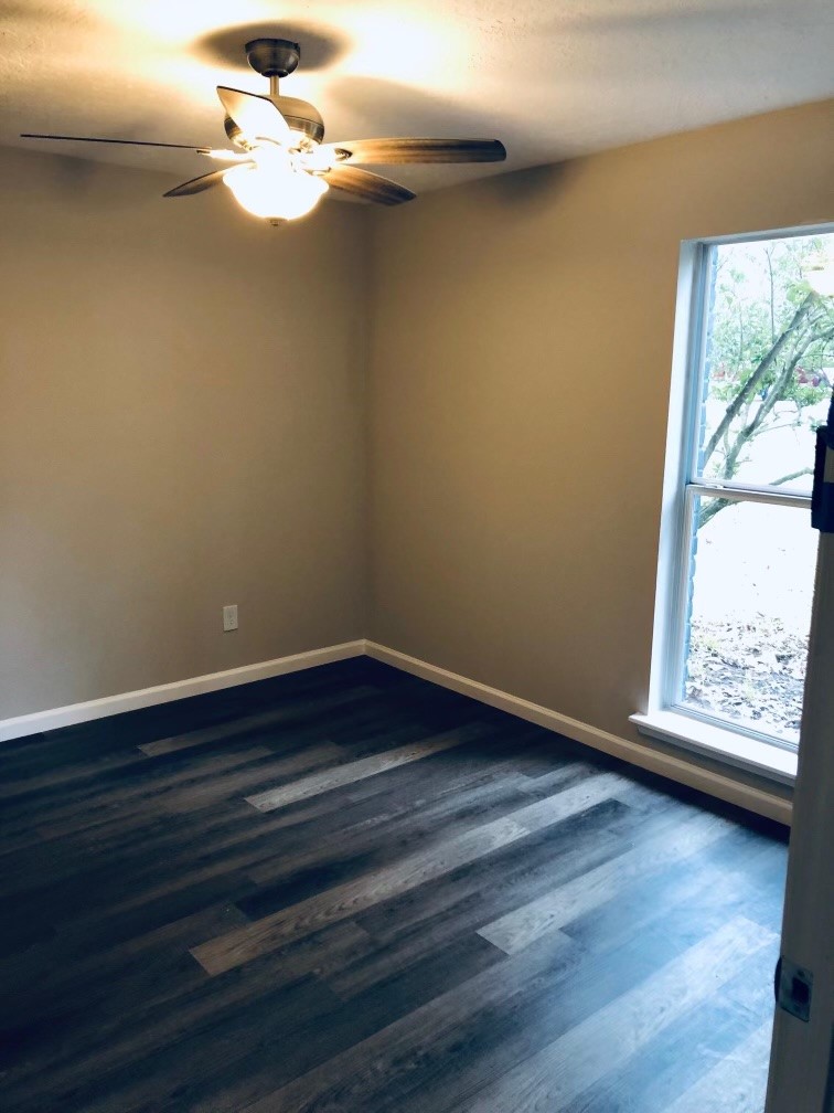 24803 Hickory Hill Road Spring, TX 77380 - Photo 10 of 13 a view of an empty room with wooden floor and a window