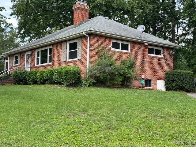 7401 Biscayne Road Henrico, VA 23294 - Photo 2 of 29 View of property exterior featuring a chimney, a l