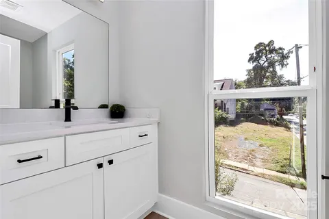 a bathroom with a sink and a window