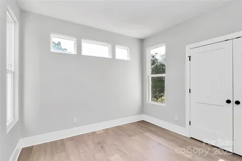 an empty room with windows