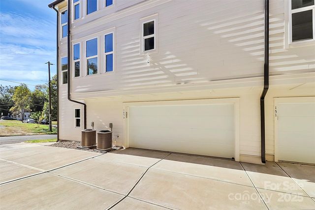 a view of a building with a garage