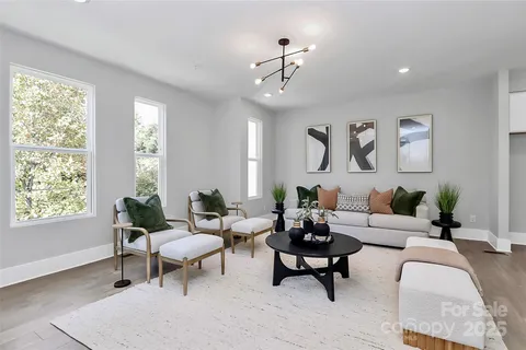 a living room with furniture and windows