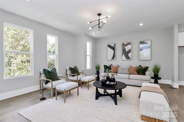 a living room with furniture and windows
