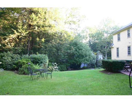 39 McCall Road Winchester, MA 01890 - Photo 4 of 11 a view of yard with grass and a fountain
